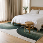 Absida Sage Rug in a bedroom