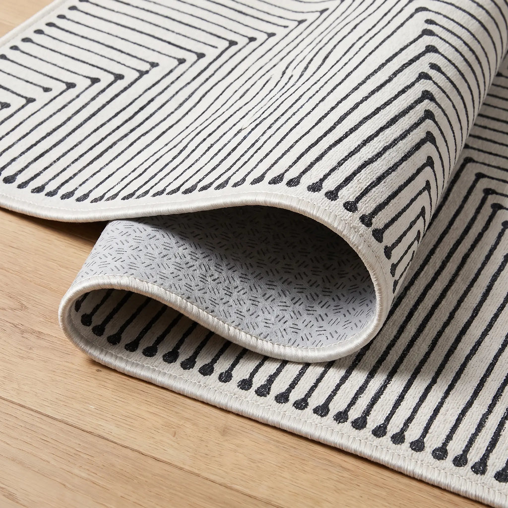 Inkdrop Black and Ivory Rug folded corner detail