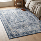 Kamran Admiral Blue Rug in a bedroom