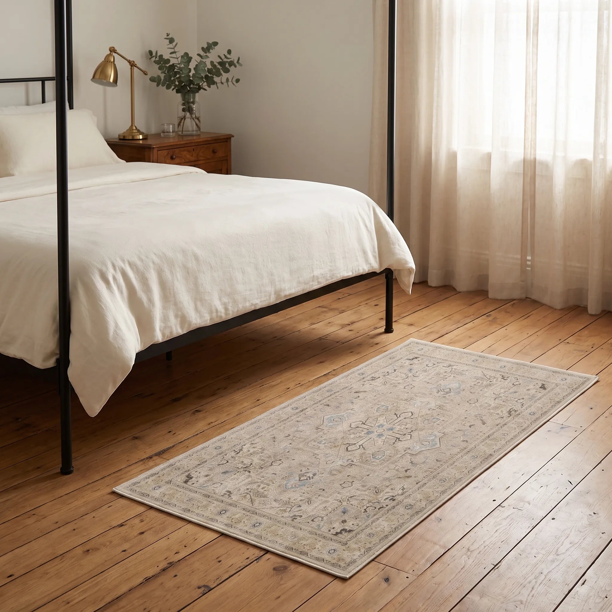 Kamran Ivory Opal Rug beside a bed