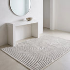 Labyrinth Black and Ivory Rug in an entryway