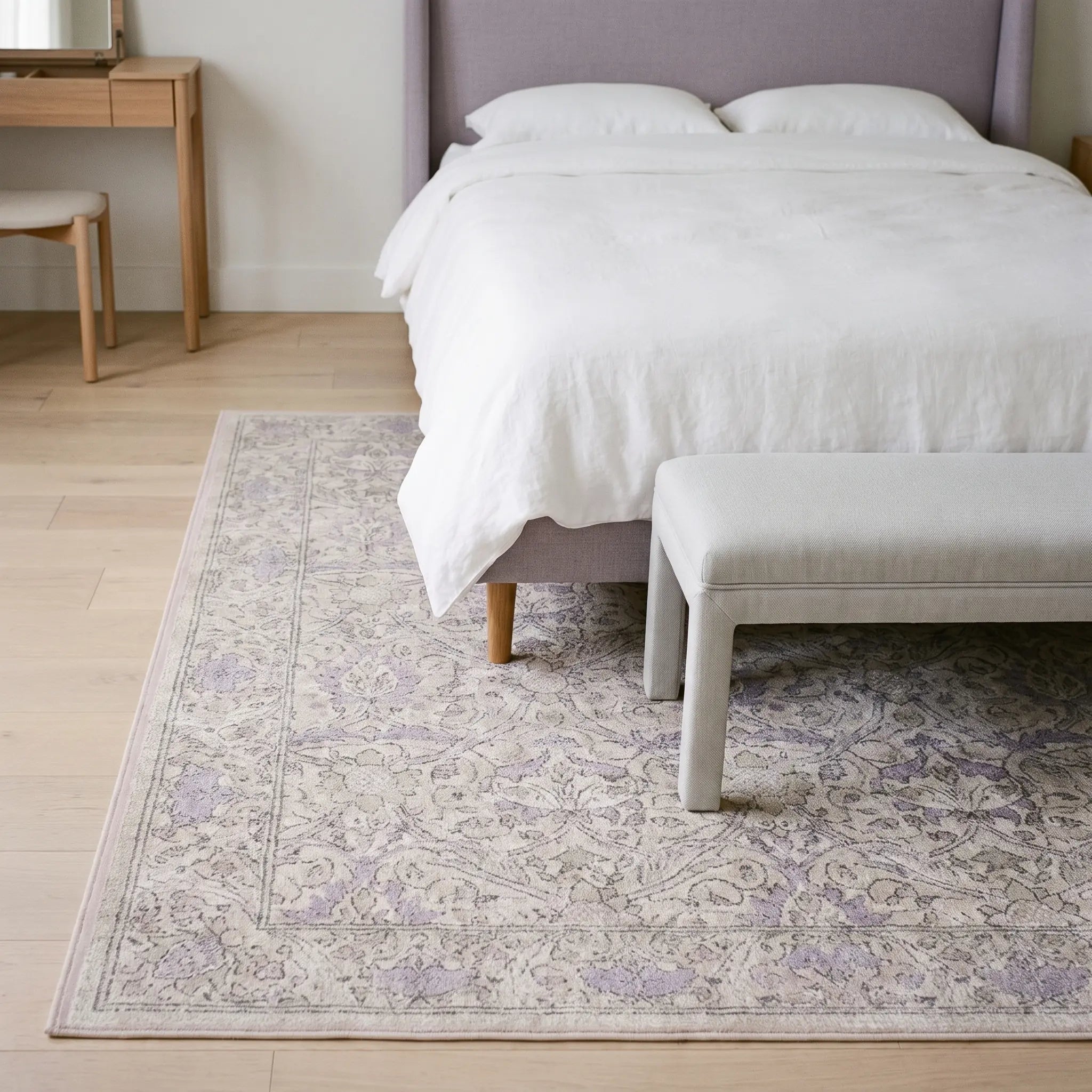 Montreal Beige and Lilac Rug in a bedroom