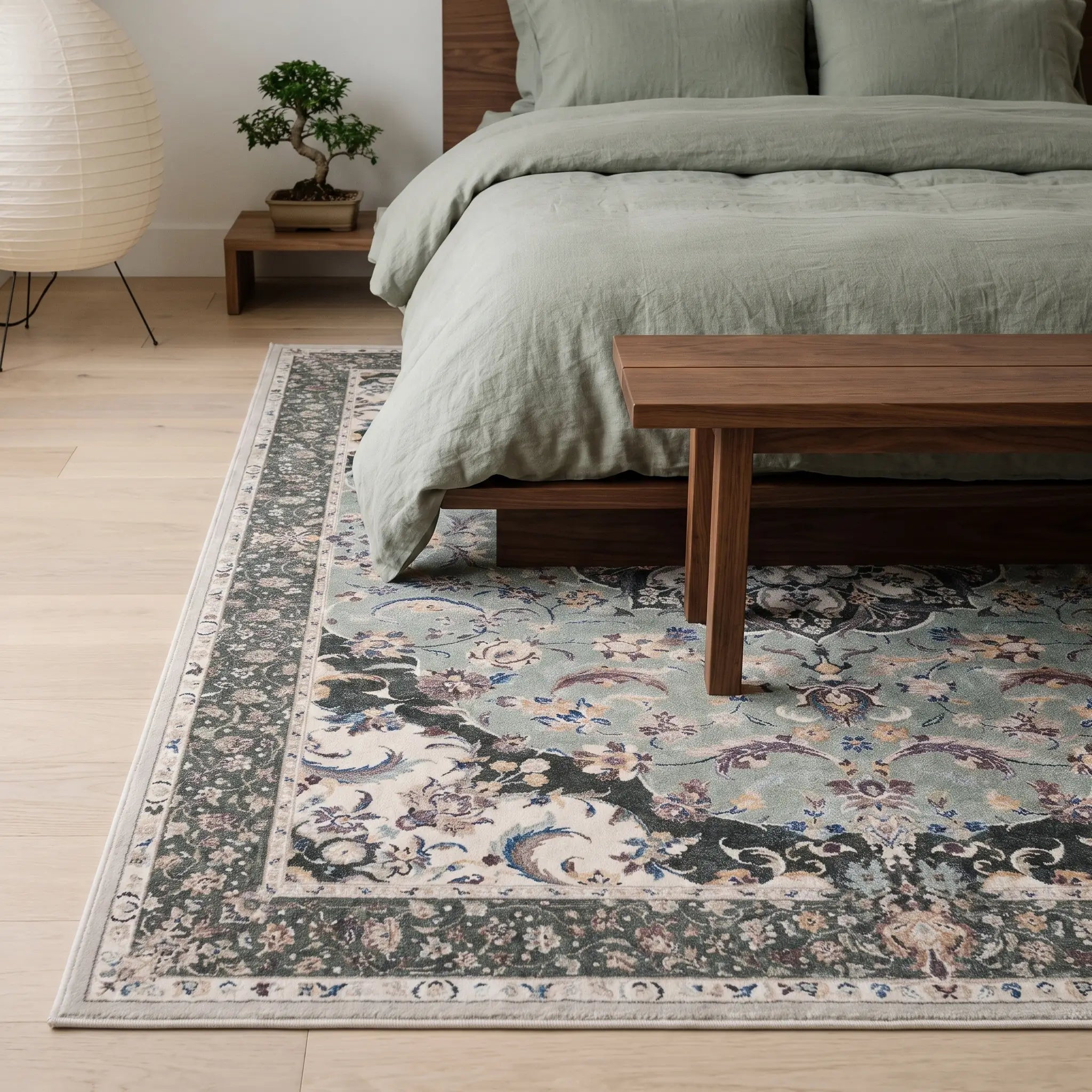 Sima Sage Rug in a bedroom