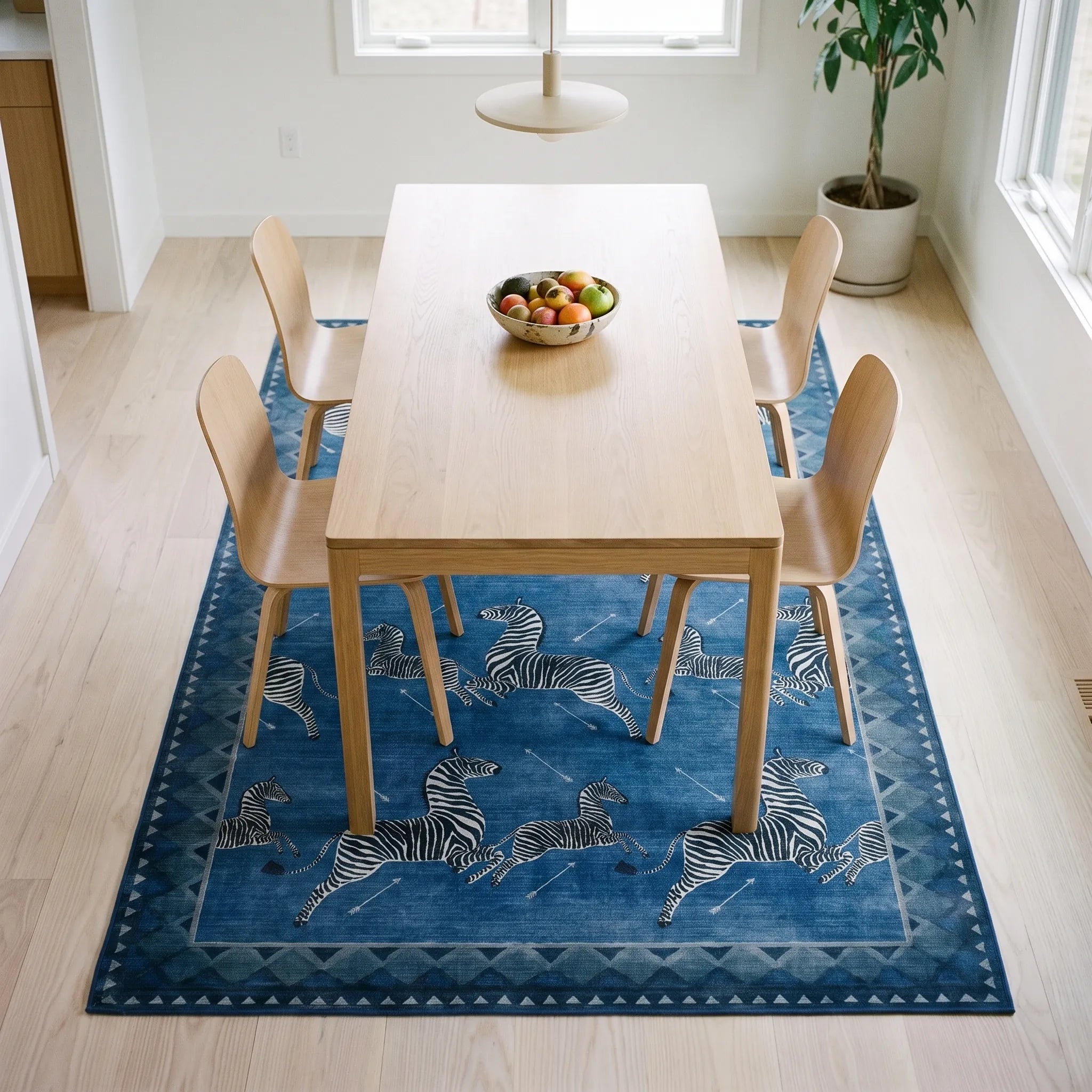 Zebras Blue Rug in a dining room